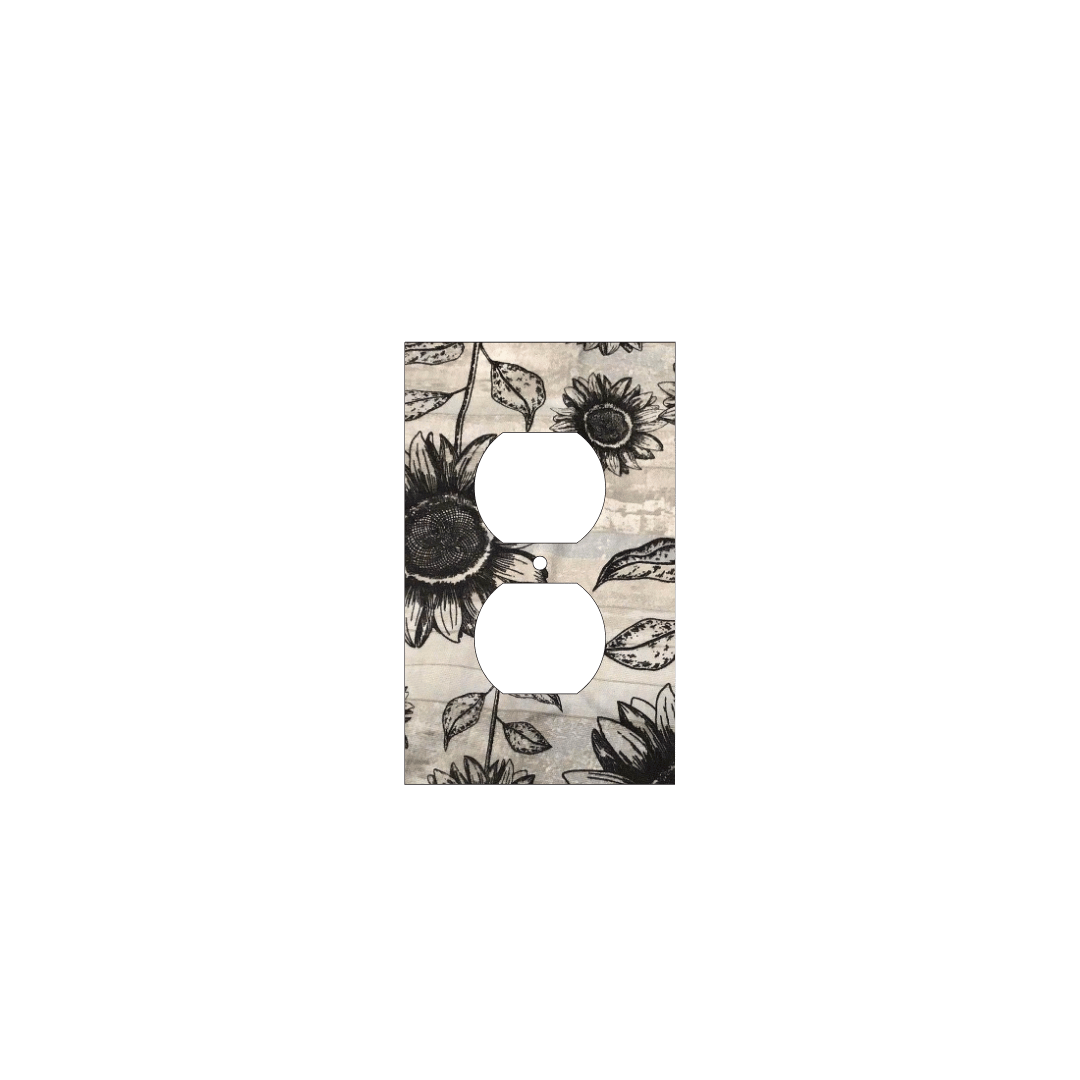 Handmade decorative light switch cover with bold black sunflowers on rustic beige woodgrain fabric, perfect for farmhouse and boho home décor