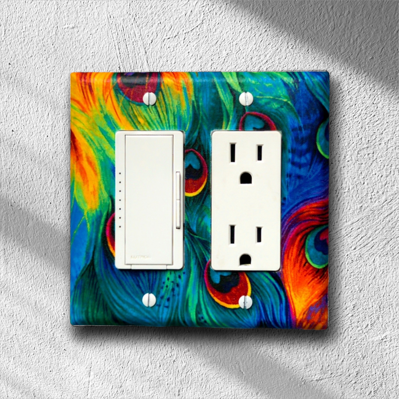 Handmade Royal Jewel Peacock Pride decorative light switch cover featuring iridescent peacock feathers in sapphire blue, emerald green, and ruby red jewel tones—luxury bohemian switch plates from Black-owned home décor.