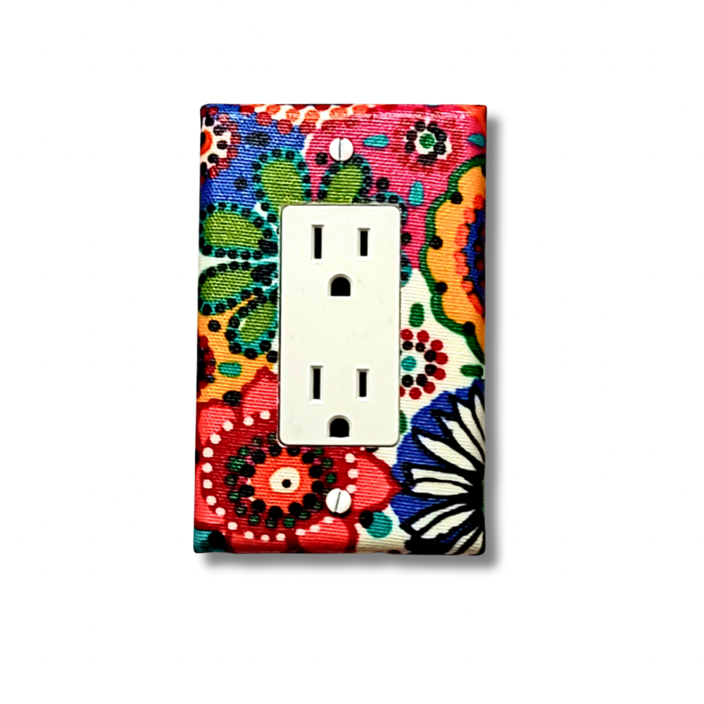 Handmade Rainbow Sunburst decorative light switch cover featuring vibrant African-inspired geometric sunburst and paisley patterns in orange, green, blue, red, pink, and yellow—cultural switch plates from Black-owned home décor.