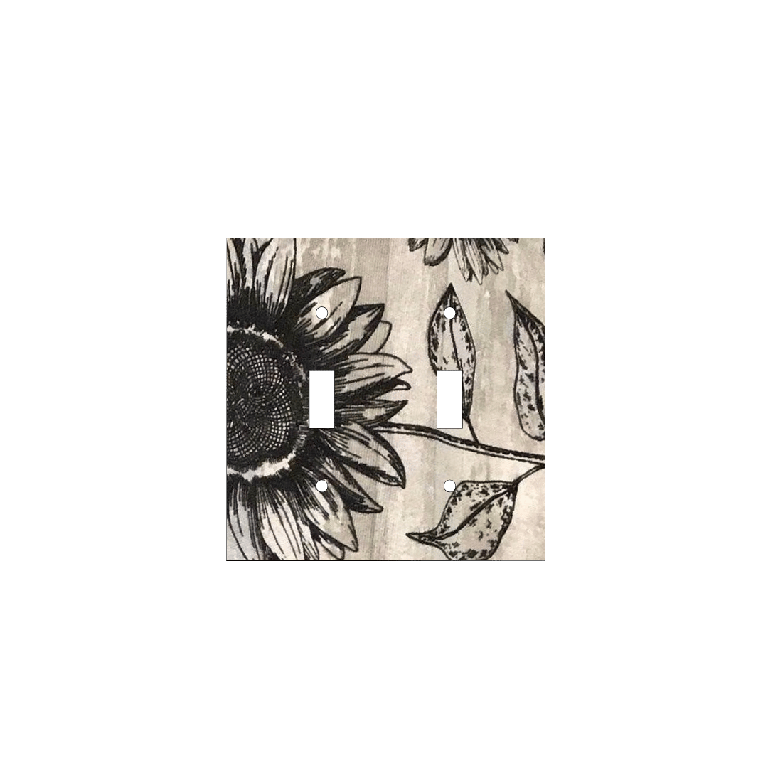Handmade decorative light switch cover with bold black sunflowers on rustic beige woodgrain fabric, perfect for farmhouse and boho home décor