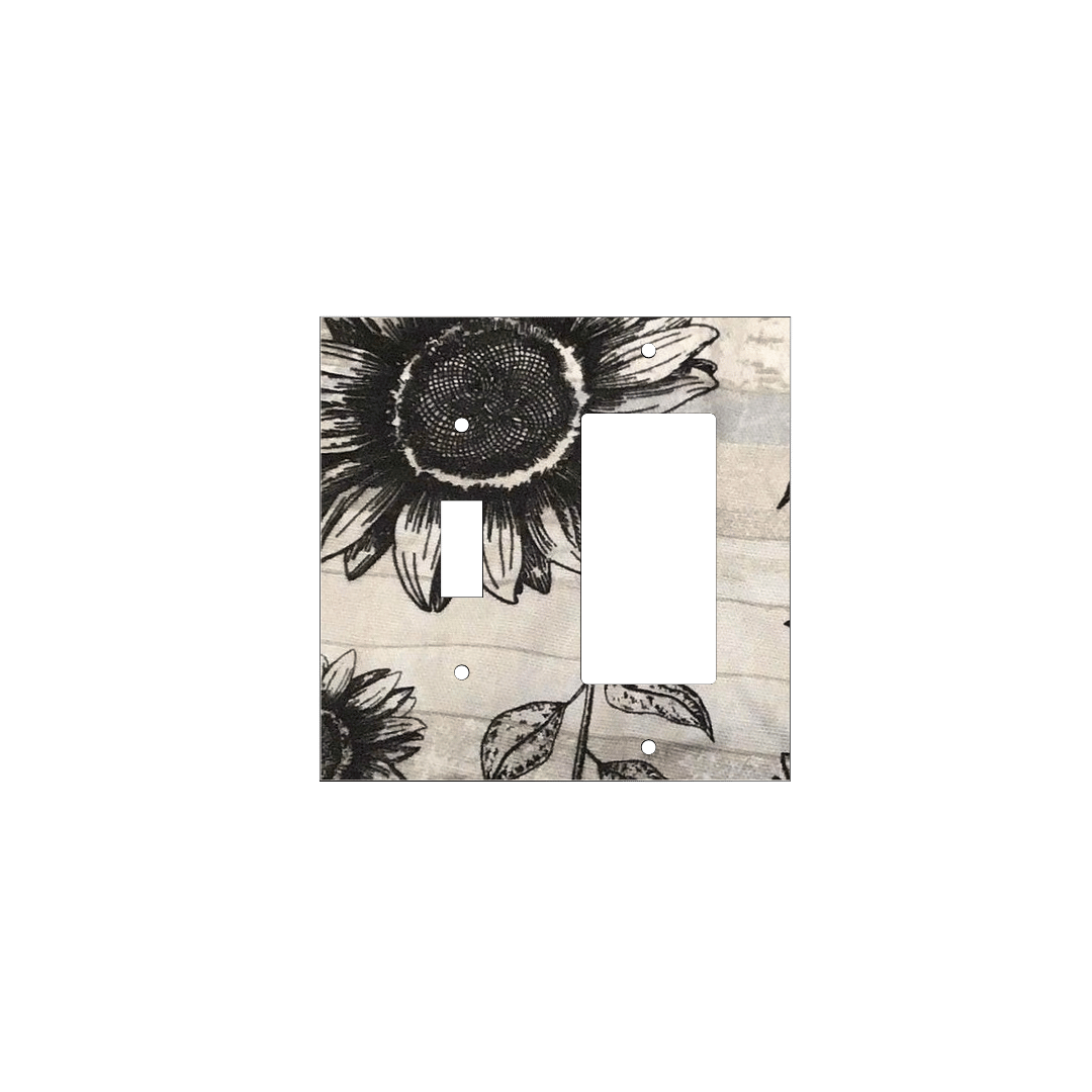 Handmade decorative light switch cover with bold black sunflowers on rustic beige woodgrain fabric, perfect for farmhouse and boho home décor