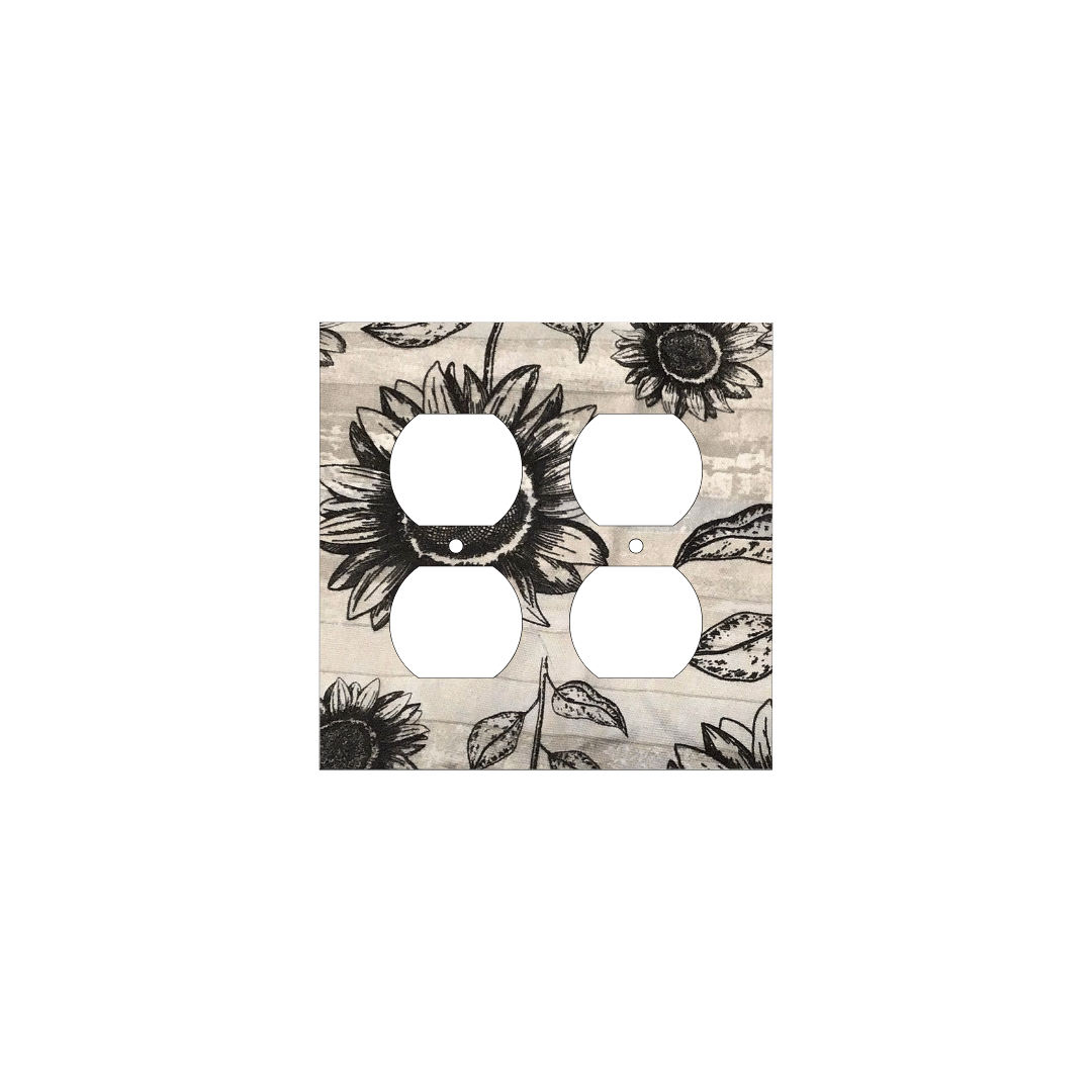 Handmade decorative light switch cover with bold black sunflowers on rustic beige woodgrain fabric, perfect for farmhouse and boho home décor