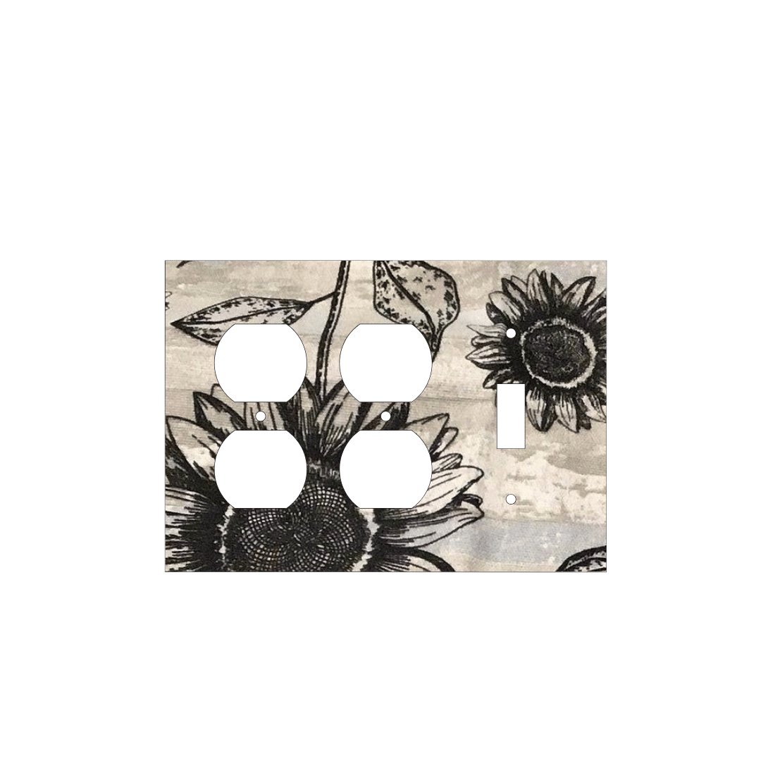 Handmade decorative light switch cover with bold black sunflowers on rustic beige woodgrain fabric, perfect for farmhouse and boho home décor