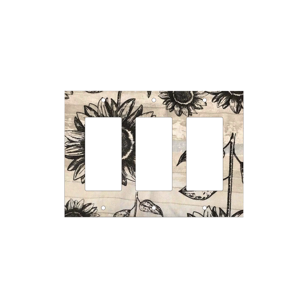 Handmade decorative light switch cover with bold black sunflowers on rustic beige woodgrain fabric, perfect for farmhouse and boho home décor