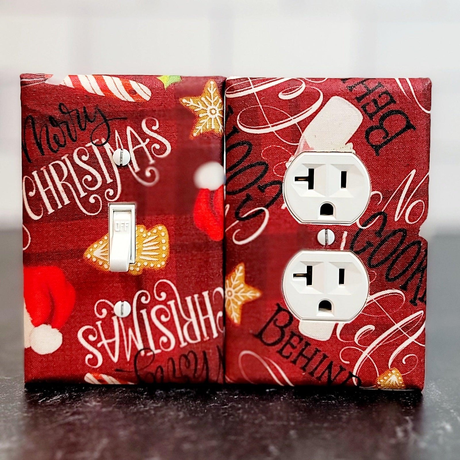 Handmade Vintage Christmas Holiday Wishes decorative light switch cover featuring Merry Christmas typography, Santa hat, and gold ornaments on deep red background—festive switch plates from Black-owned home décor.