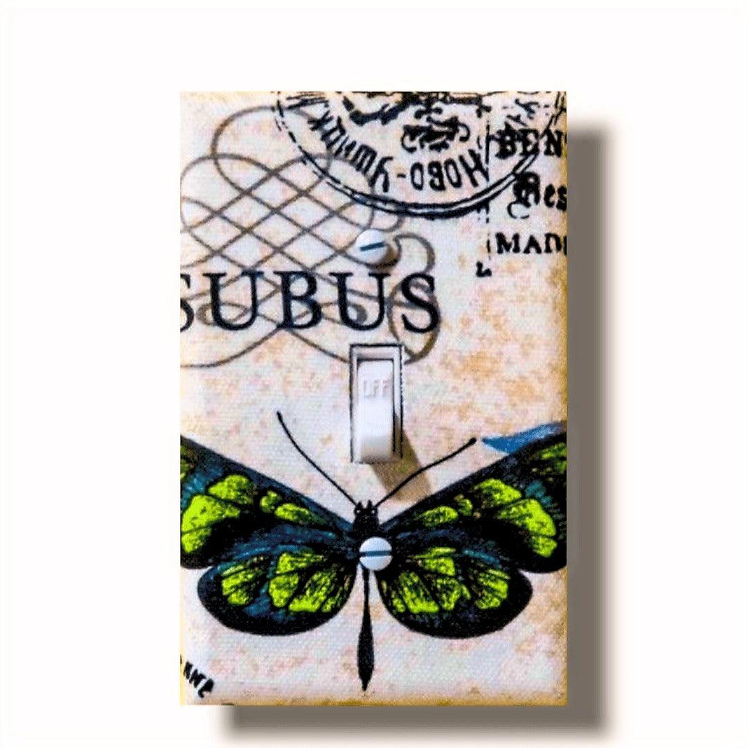 Decorative light switch covers with blue and green butterflies on vintage postage stamps, handmade Black-owned home décor, unique pieces cut from continuous fabric