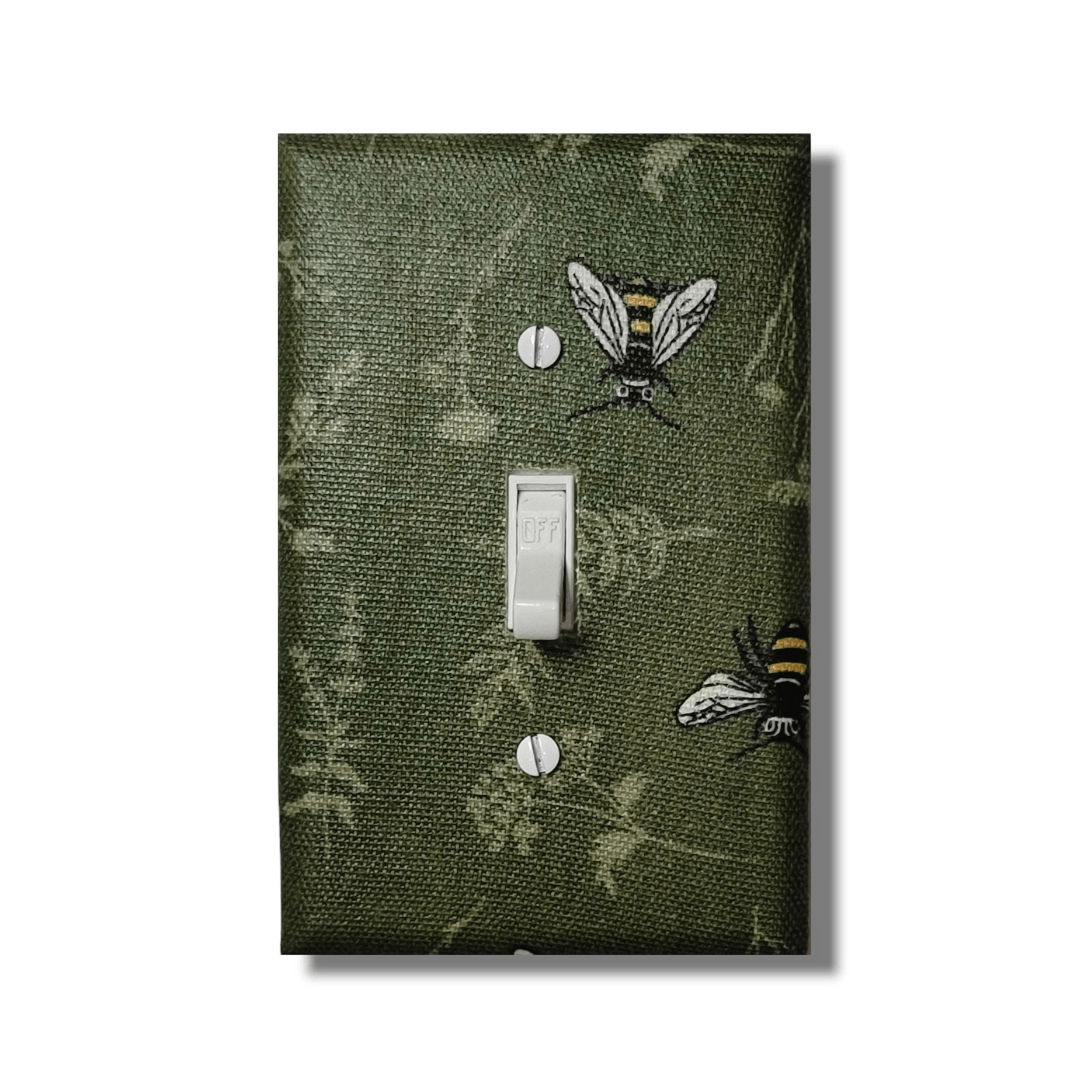 Garden keeper bee fabric switch cover with embroidered bees on sage green botanical leaf pattern, handmade by Black-owned Kustom Kreationz by Kila