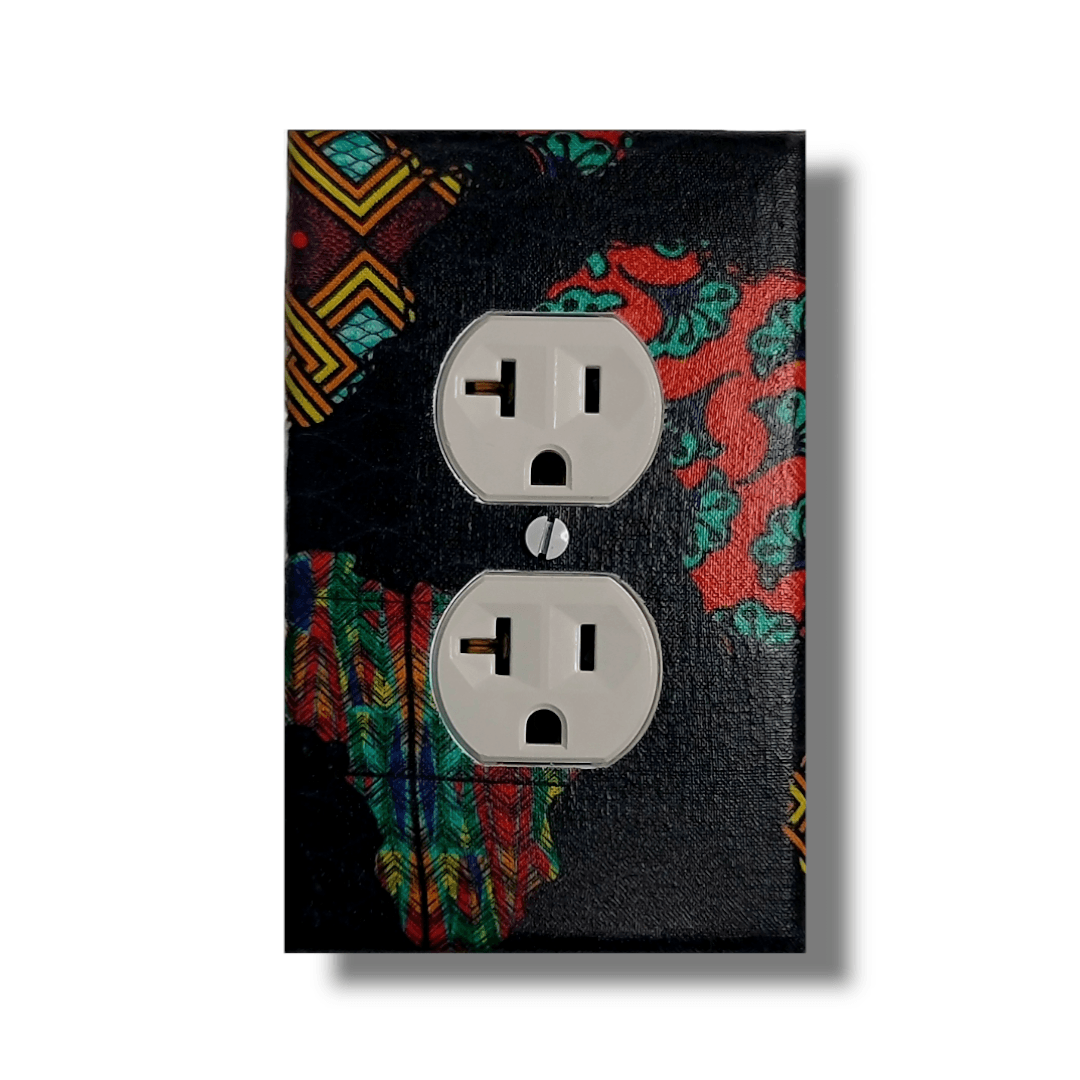 African continent single outlet cover featuring Kente and Ankara collage fabrics on deep navy blue base, handmade wall décor. Kustom Kreationz by Kila