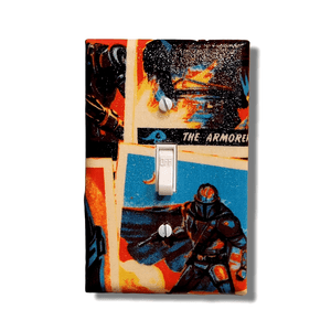 Handmade The Armorer's Way Star Wars decorative light switch cover featuring The Armorer and Mandalorian warriors with galaxy backdrop in vintage poster style—officially licensed Mandalorian switch plates from Black-owned home décor.