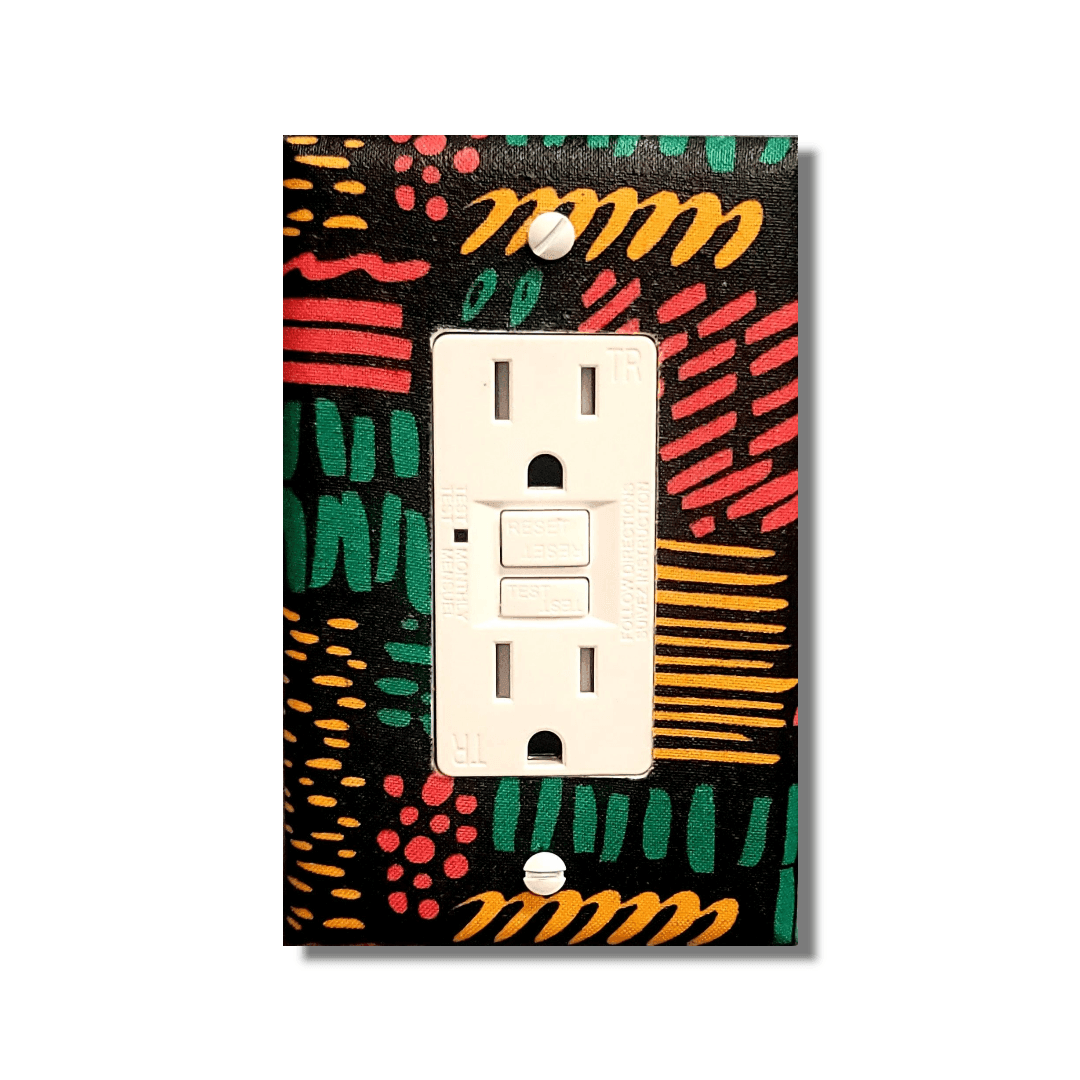 Handmade double toggle light switch cover with energetic abstract design featuring dynamic coral-red, turquoise, and golden-orange marks, stripes, dots, and dashes creating visual rhythm on deep black background for bold expressive home décor