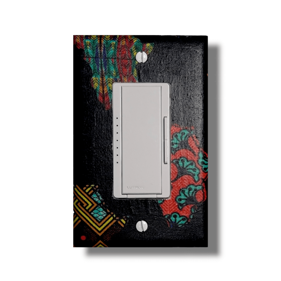 
African continent single decora light switch cover featuring Kente and Ankara collage fabrics on deep navy blue base, handmade wall décor.- Kustom Kreationz by Kila