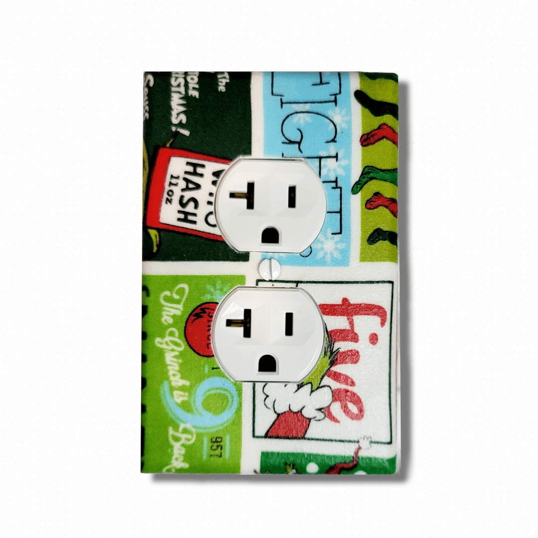 Handmade The Grinch Holiday Spirit decorative light switch cover featuring the Grinch with retro comic panel style and holiday text—officially licensed Dr. Seuss switch plates from Black-owned home décor.