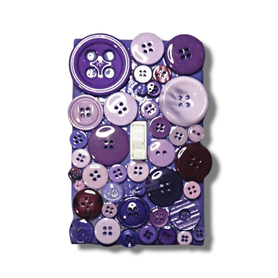Purple rain button treasure vintage switch plate with glossy and patterned buttons in eggplant, royal purple, lavender and mauve tones, handmade by Black-owned Kustom Kreationz by Kila