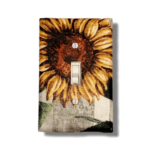 Handmade Golden Harvest Sunflower Fields decorative light switch cover featuring painted sunflower bloom with golden petals on natural linen background—farmhouse botanical switch plates from Black-owned home décor.
