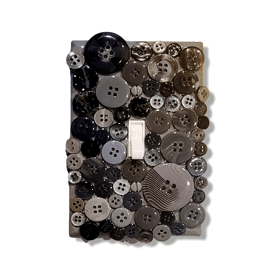 Beautiful morning fog button treasure decorative switch plate with glossy and matte buttons in black, charcoal, slate grey, taupe and cream tones with striped pattern, handmade by Black-owned Kustom Kreationz by Kila