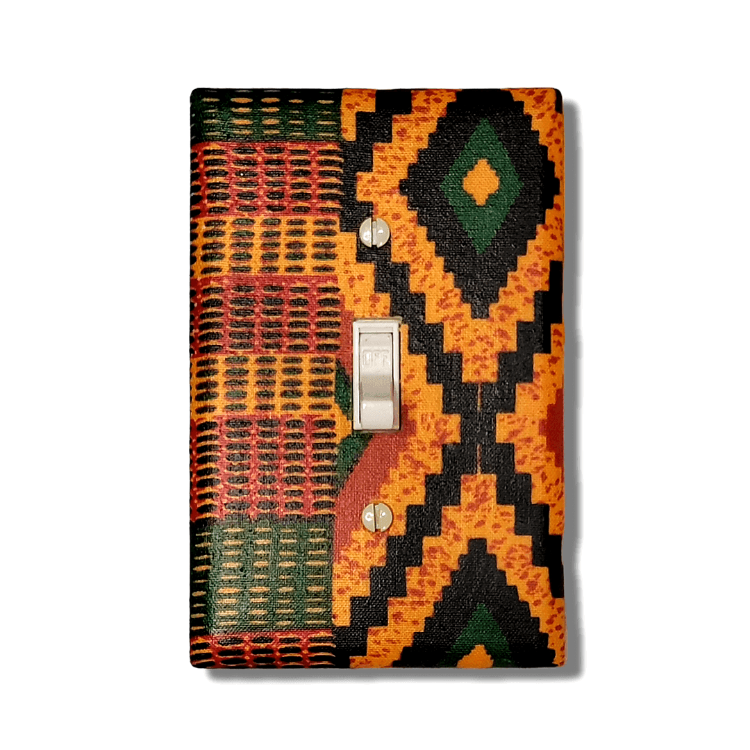 Handmade toggle light switch cover featuring authentic Ghanaian kente cloth pattern with geometric designs in vibrant orange, black, forest green, and coral showcasing traditional African textile weaving for cultural heritage home décor