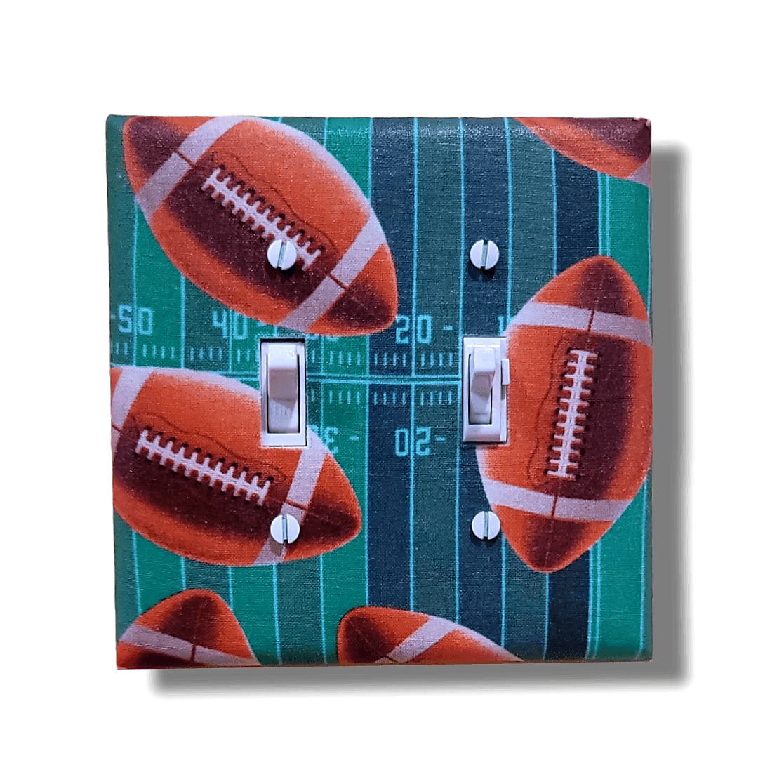 Handmade Fantasy Football Field of Dreams decorative light switch cover featuring realistic football field with yard lines and footballs—game day switch plates from Black-owned home décor.