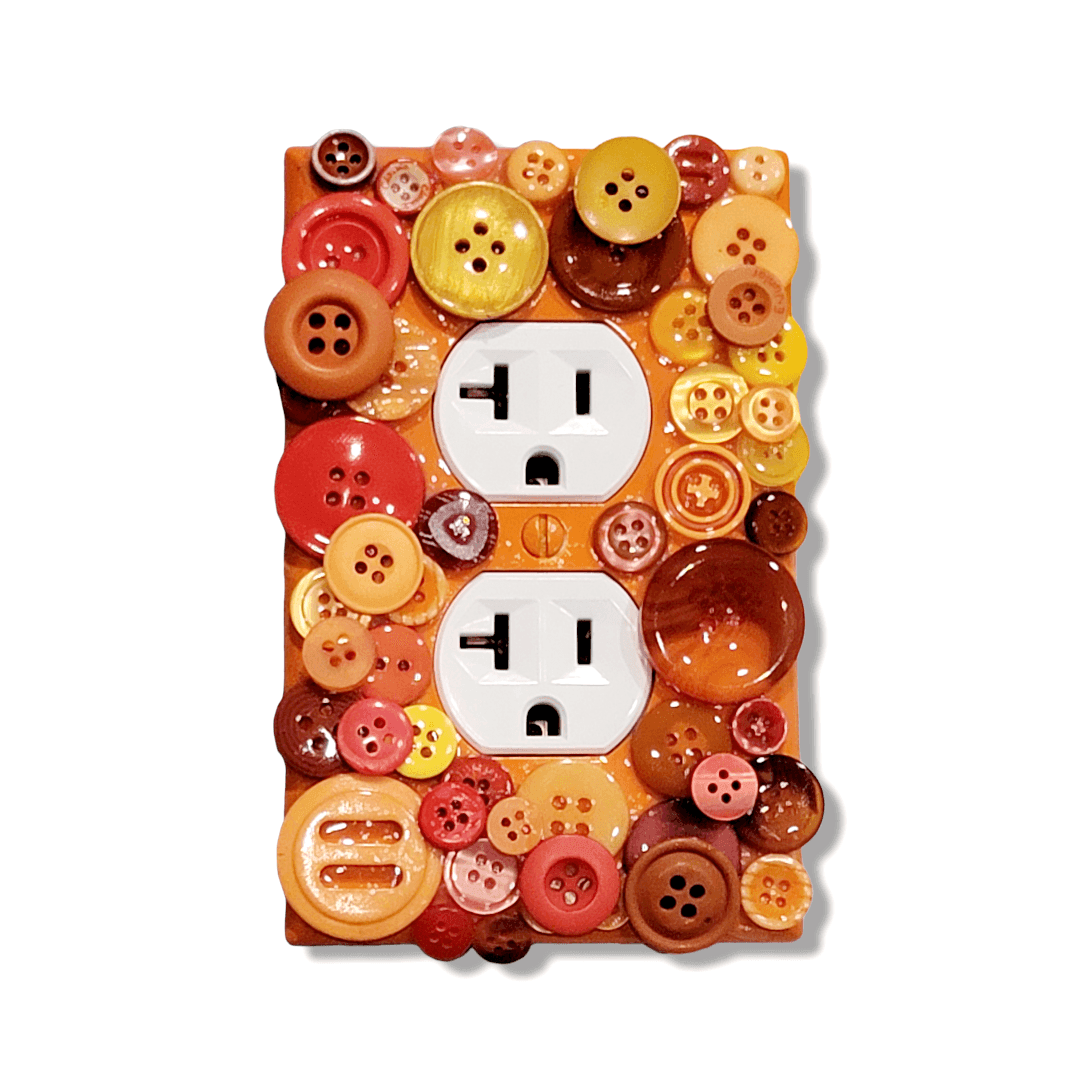 Marigold mix button mosaic decorative switch plate with translucent and glossy buttons in golden yellow, burnt orange, coral and terracotta tones, handmade by Black-owned Kustom Kreationz by Kila