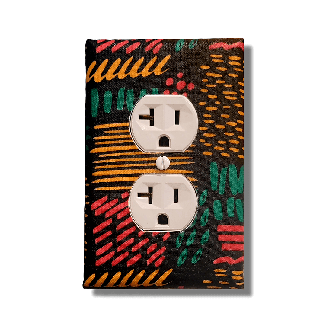 Handmade double toggle light switch cover with energetic abstract design featuring dynamic coral-red, turquoise, and golden-orange marks, stripes, dots, and dashes creating visual rhythm on deep black background for bold expressive home décor