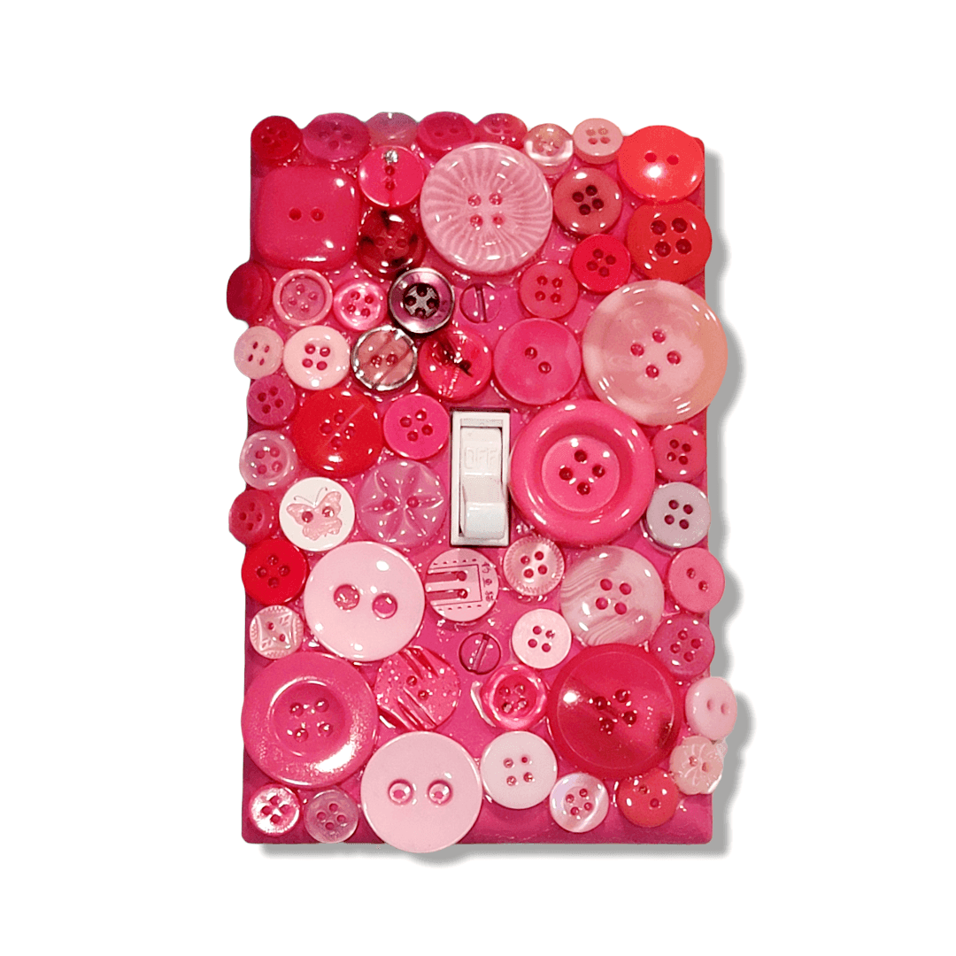 Cotton candy button mosaic handmade switch cover with translucent and opaque vintage buttons in baby pink, hot pink, fuchsia and blush tones, handmade by Black-owned Kustom Kreationz by Kila