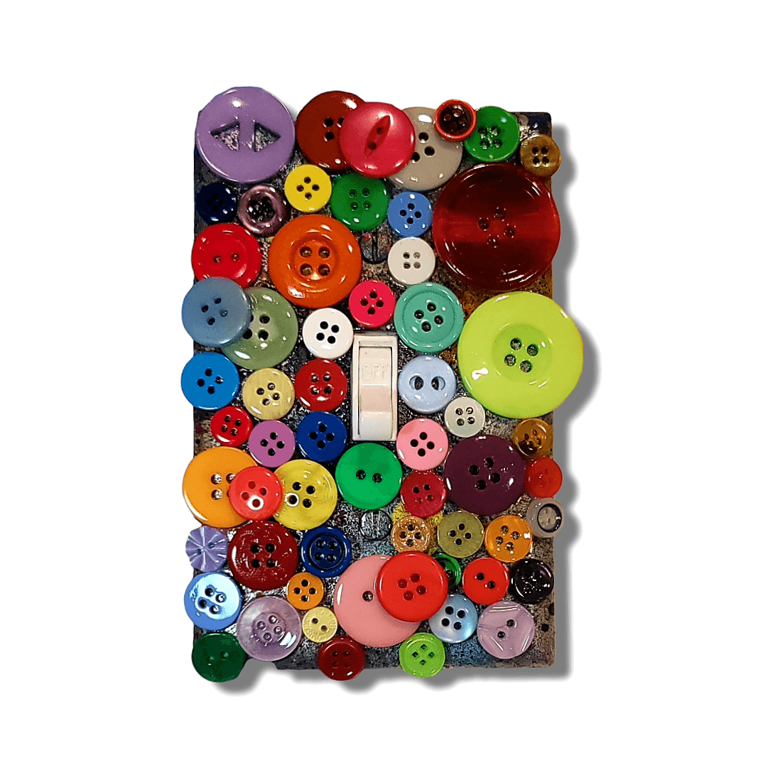Rainbow rebellion button treasure vintage switch plate with glossy and matte buttons in purple, red, pink, orange, yellow, green, blue and burgundy creating full spectrum of colors, handmade by Black-owned Kustom Kreationz by Kila