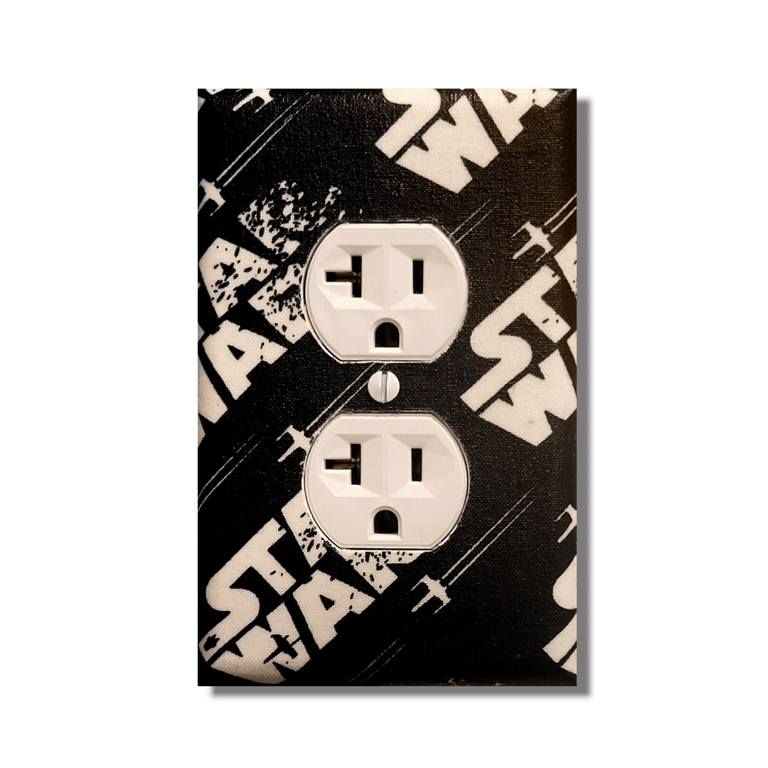 Handmade Star Wars decorative light switch cover featuring vintage black and cream X-Wing design with distressed logo—officially licensed Black-owned fan home décor.