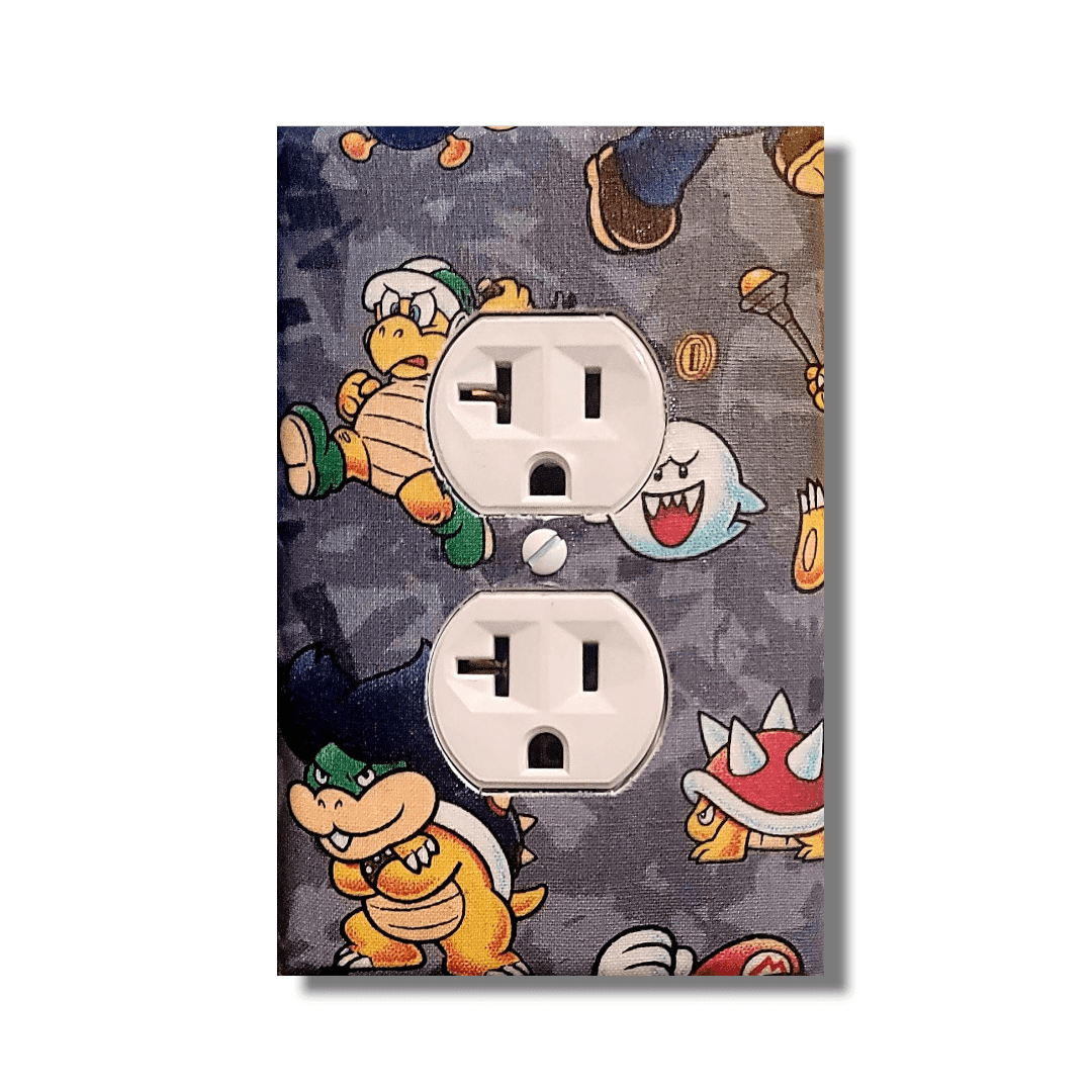 Handmade Super Mario Level Up decorative light switch cover featuring Mario, Bowser, Larry Koopa, and coins on gray camo background—officially licensed Nintendo switch plates from Black-owned home décor.